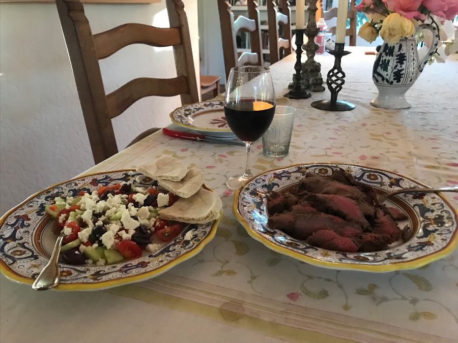 Greek salad with pita bread and flank steak
