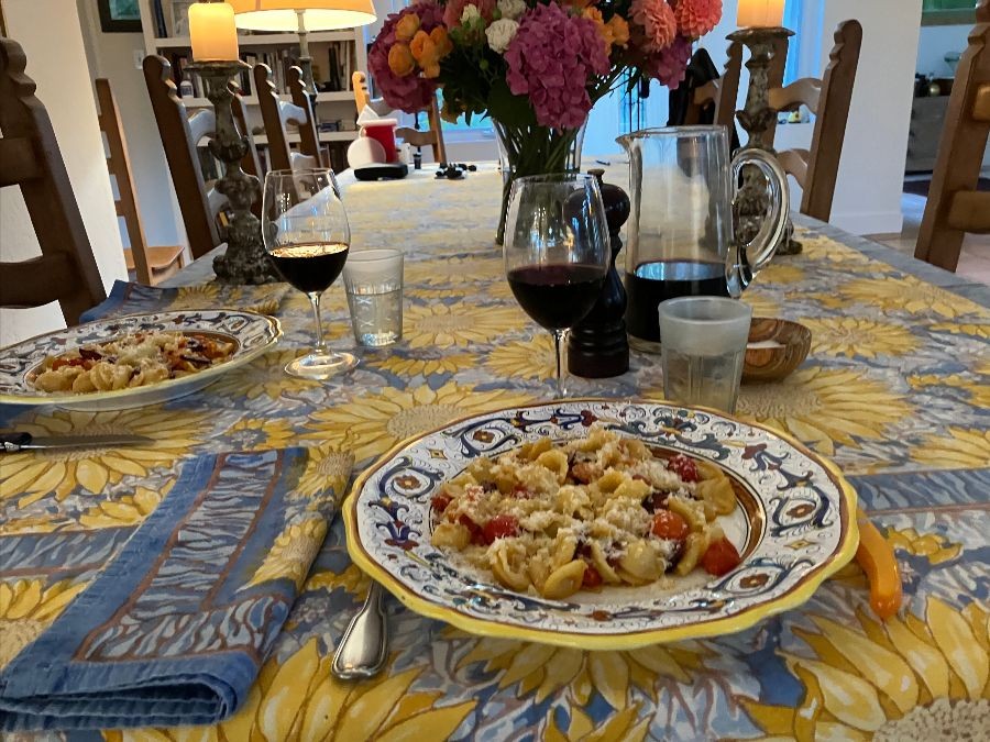 Colorful table setting with pasta dishes